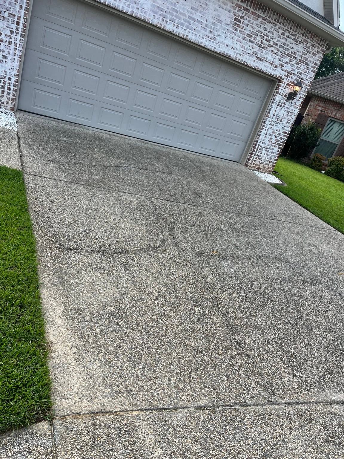 Dirty driveway before pressure washing